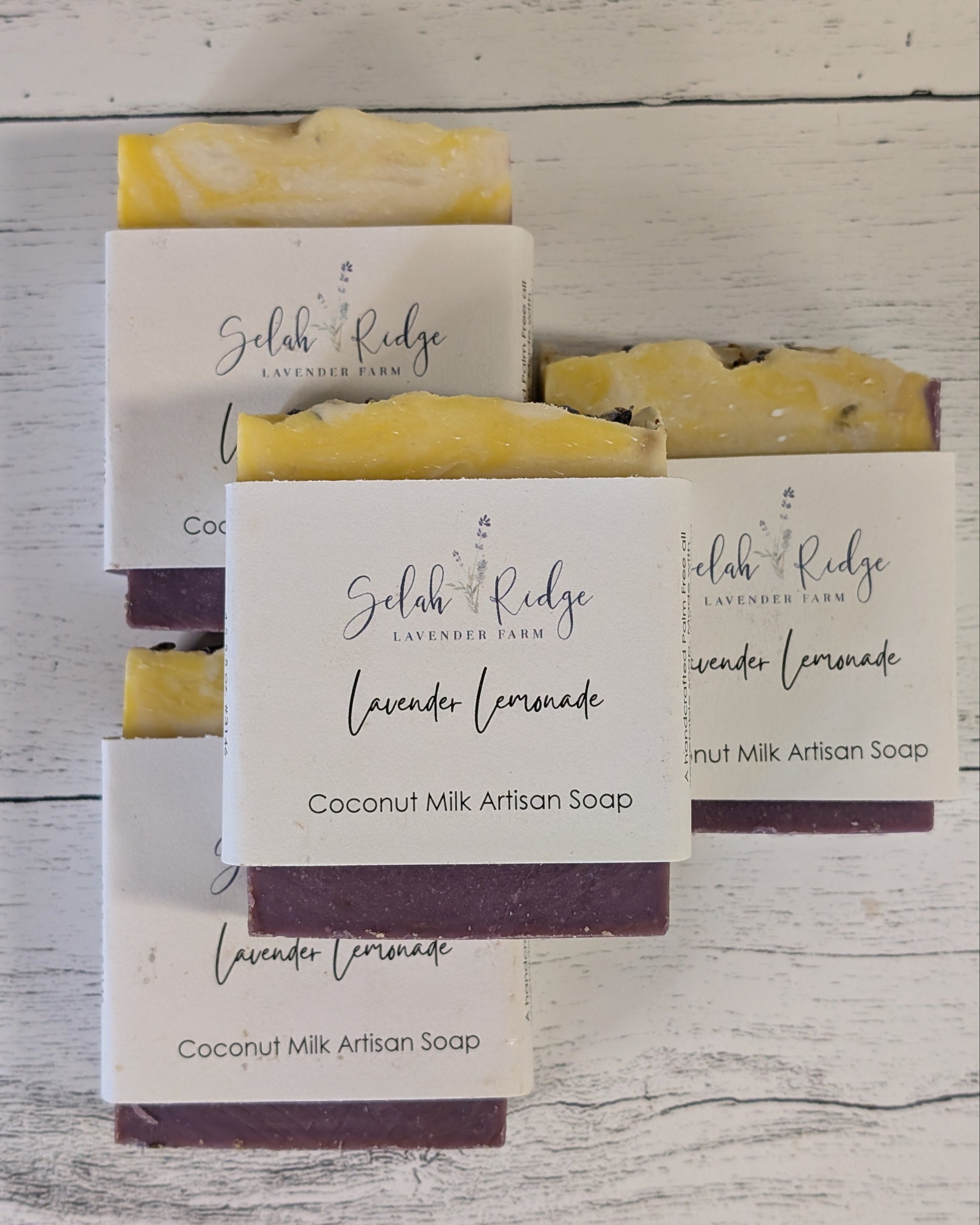 Coconut Milk Artisan Soap bars with 'Gelah Ridge' packaging on a wooden surface