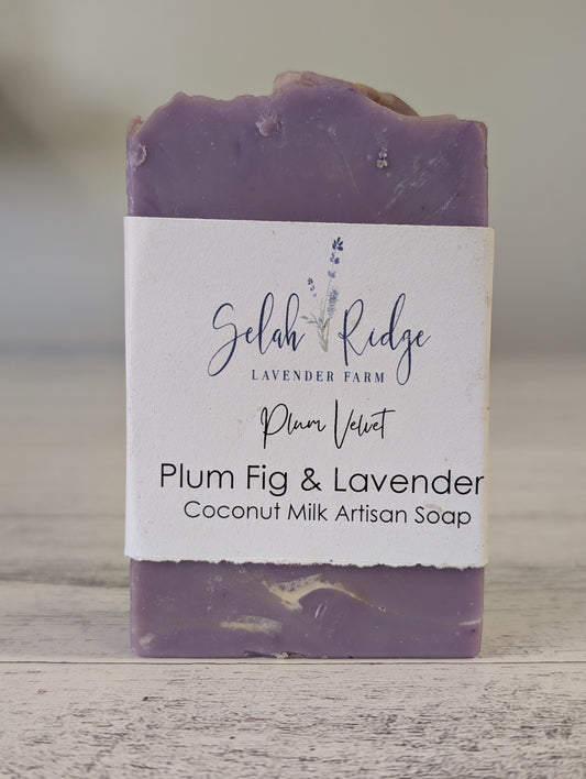 Bar of soap with a label on a wooden surface